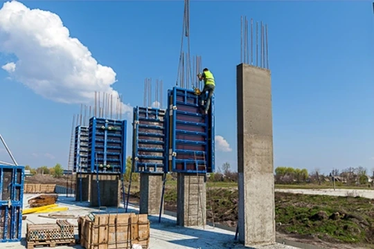 Worker removing wall shutters